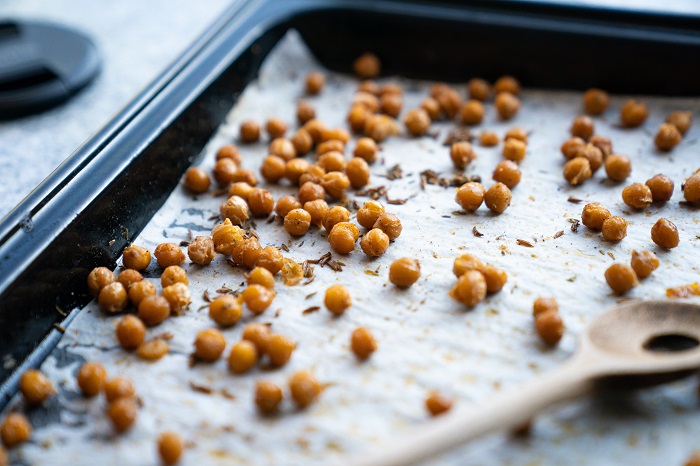 Several chickpeas on a baking sheet