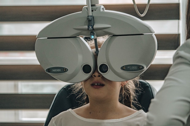 a young child getting an eye exam